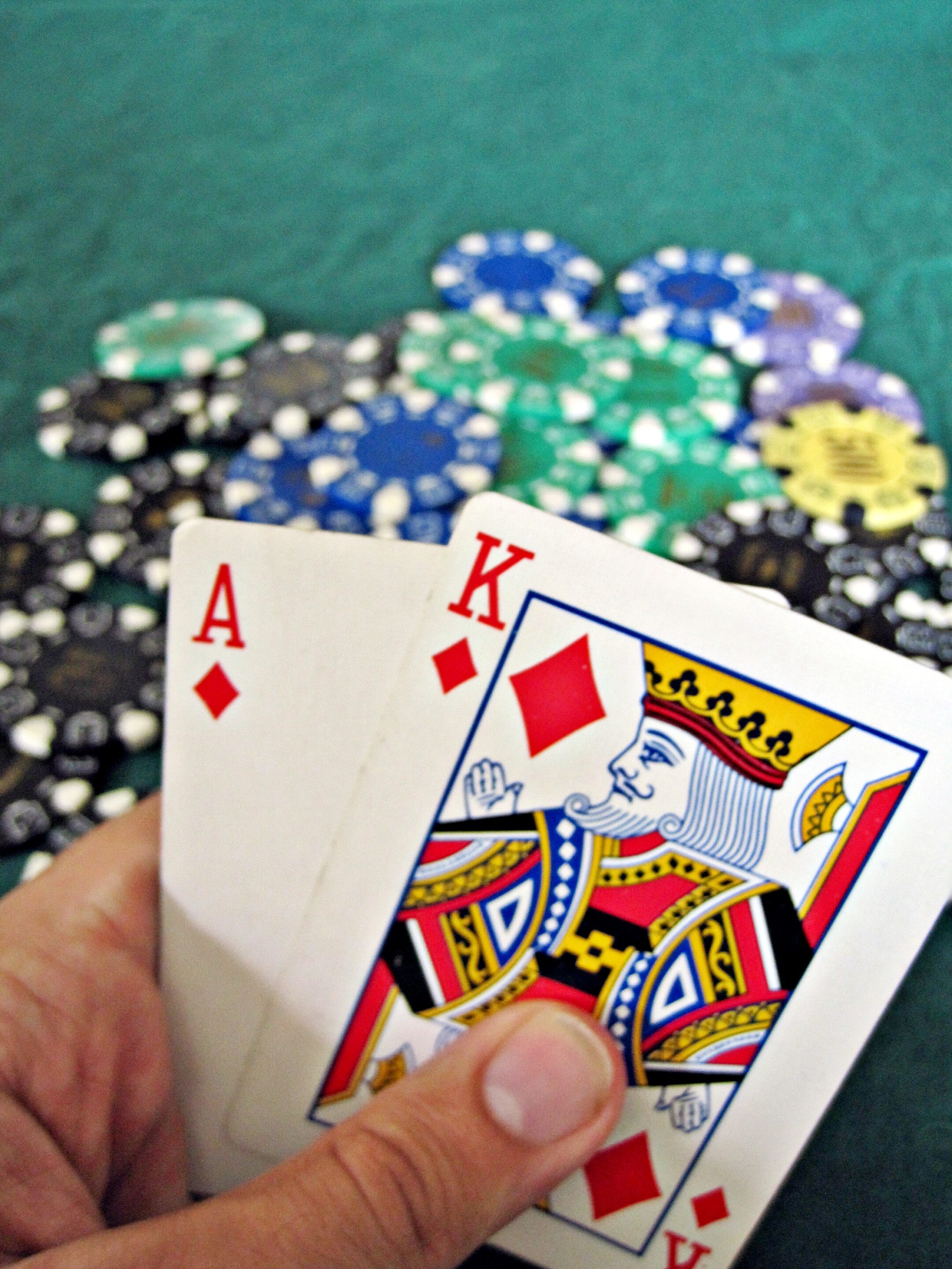 Blackjack table and casino chips representing cardroom regulation and player-dealer rules