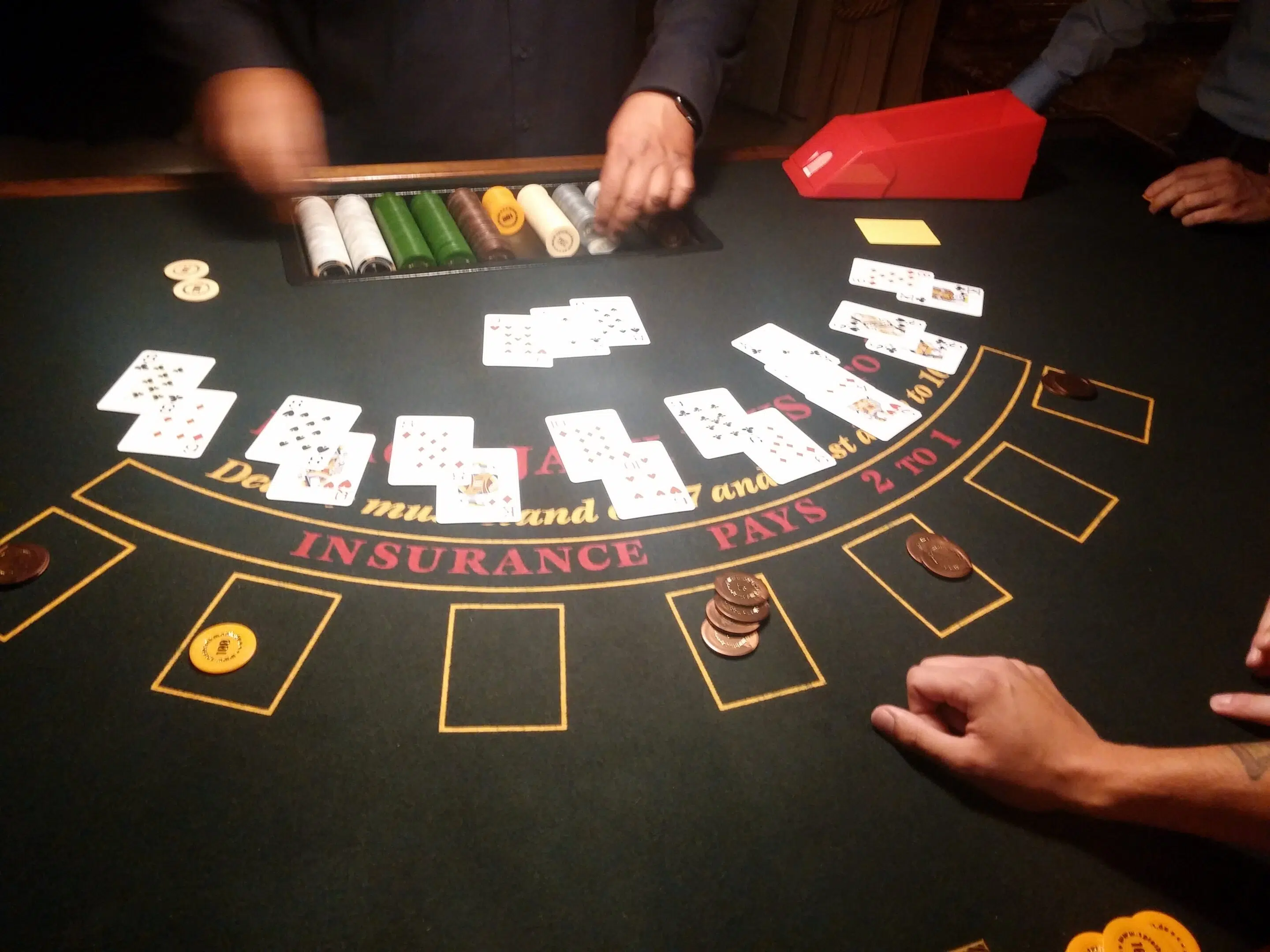 Blackjack table close-up representing live casino side bets and player experience