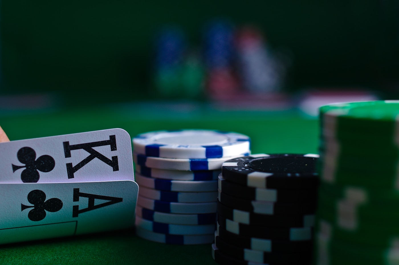 Casino dice resting on green gaming felt