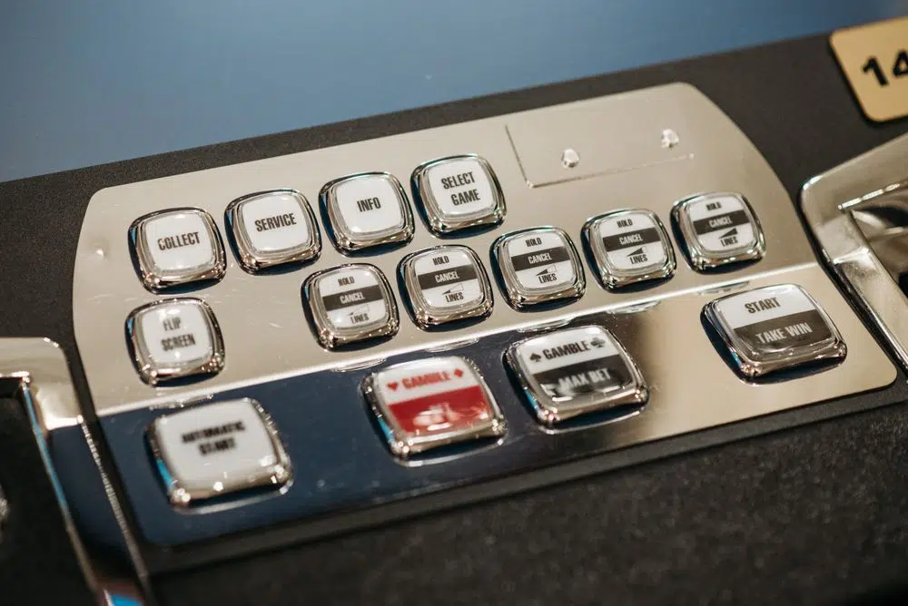 Casino machine control panel illustrating game contribution rules