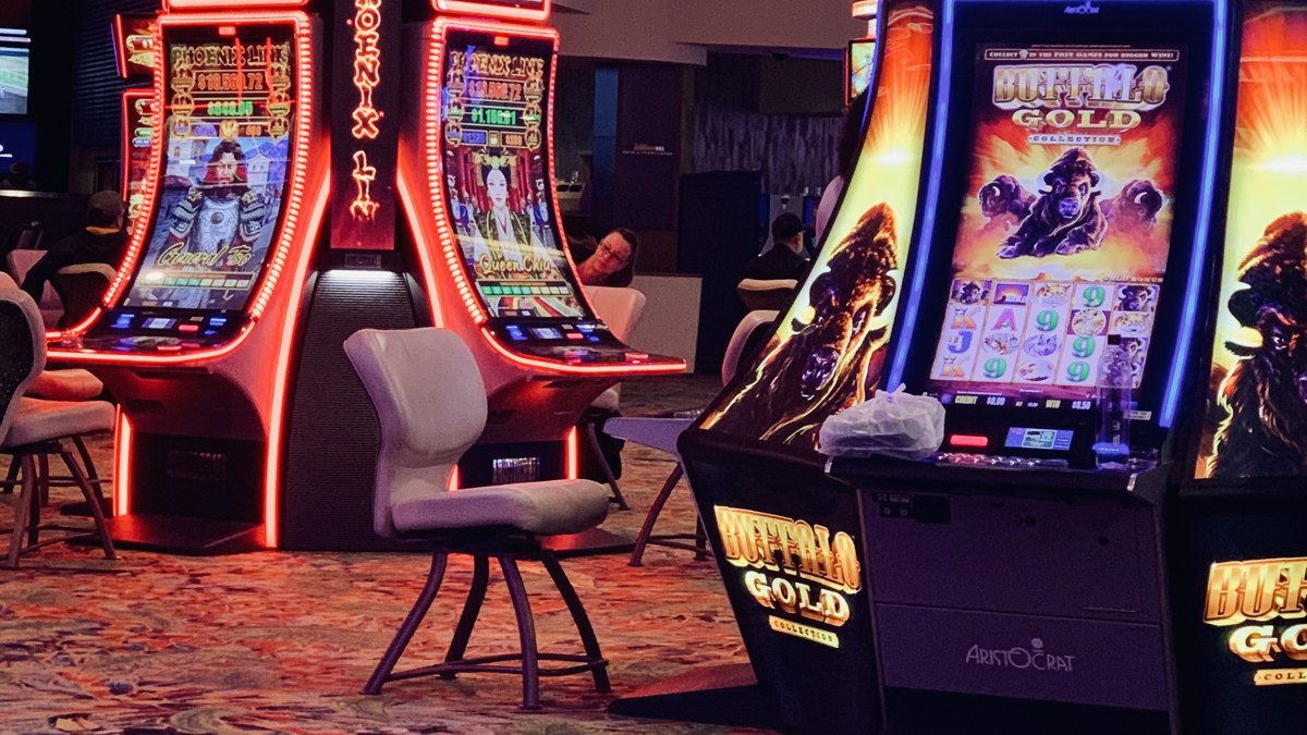 Slot machines on a casino floor representing World Cup prediction-market gambling risk