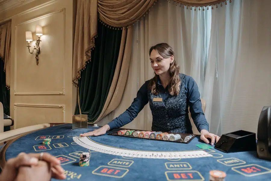 Casino dealer at a gaming table illustrating online casino loss limits