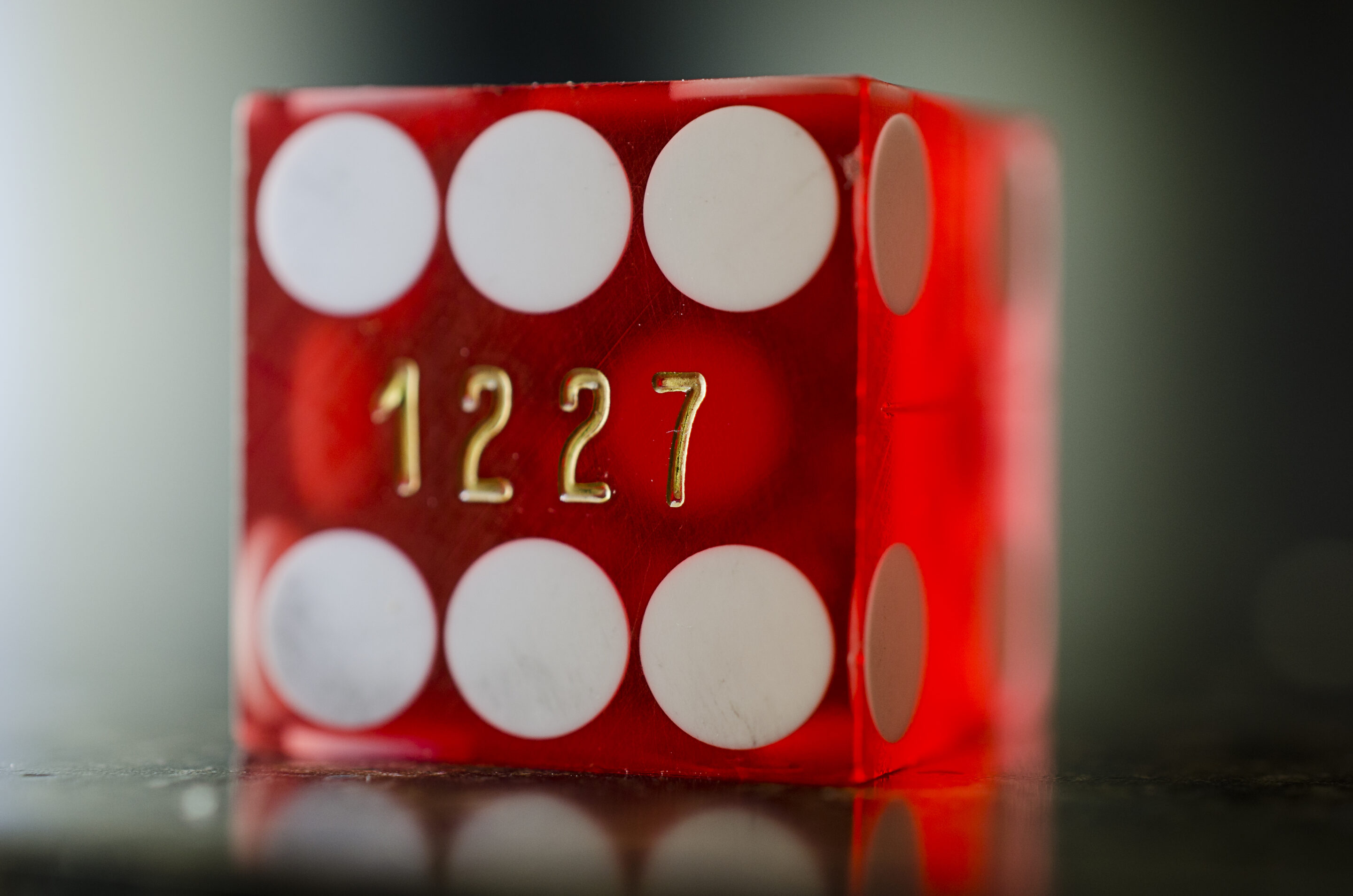 Casino dice used for gambling regulation and prediction market coverage