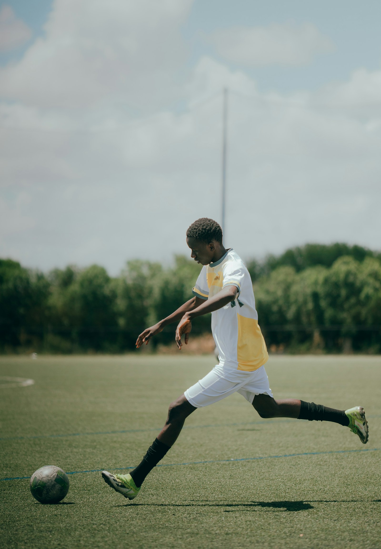 Football player striking the ball for Saudi Arabia vs Uruguay preview