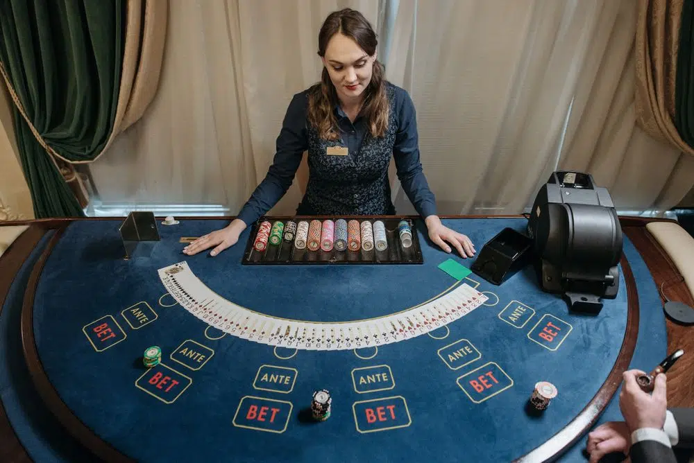 Casino dealer at a card table representing a small withdrawal test