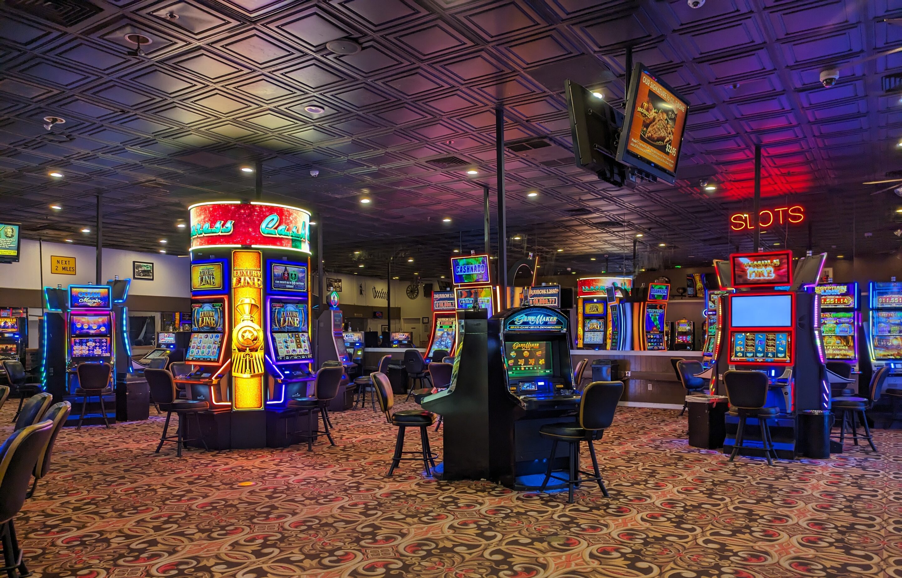 Casino slot machine floor representing slot spin cycle time