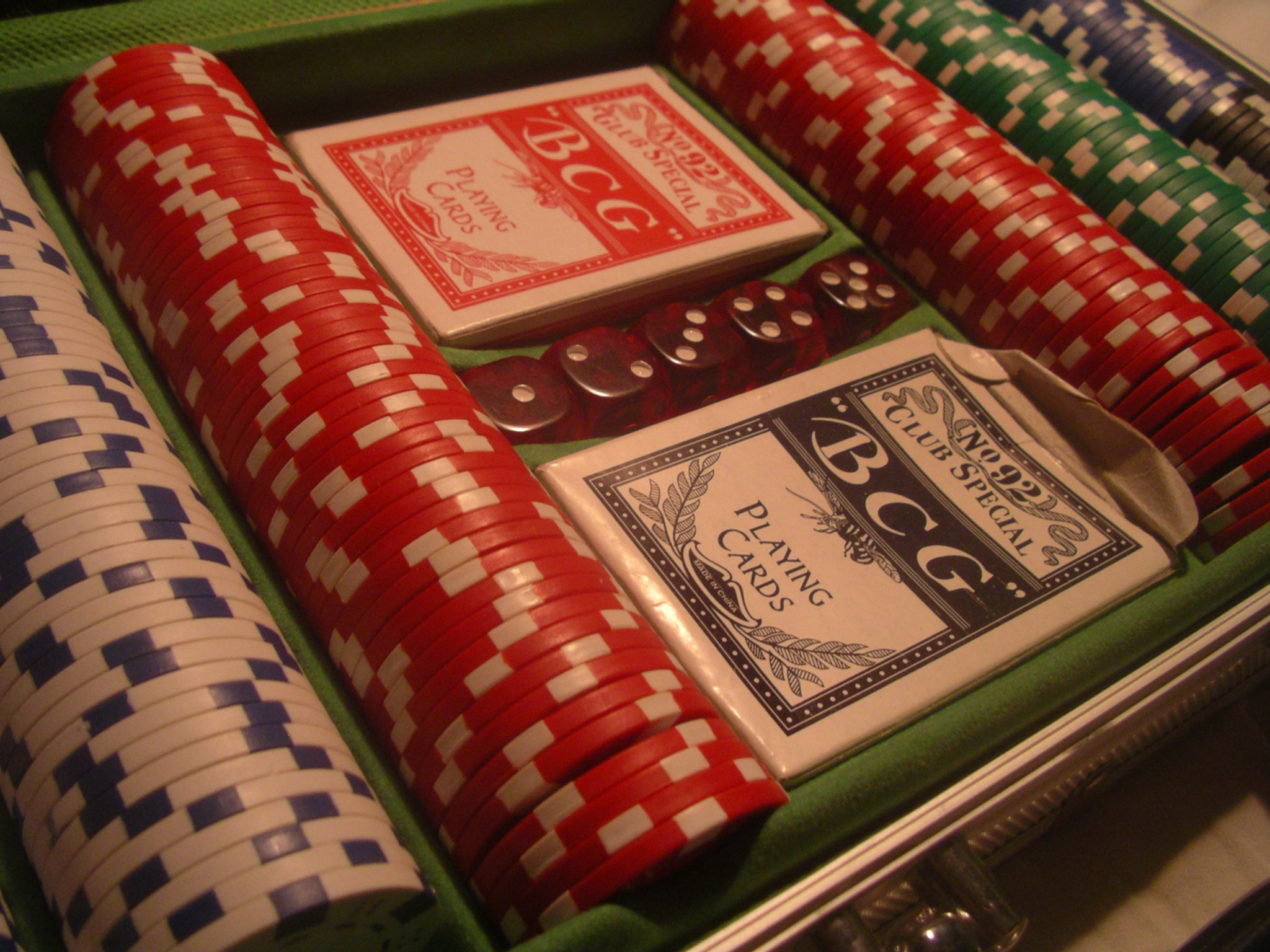 Poker chips and cards representing stablecoin casino deposits