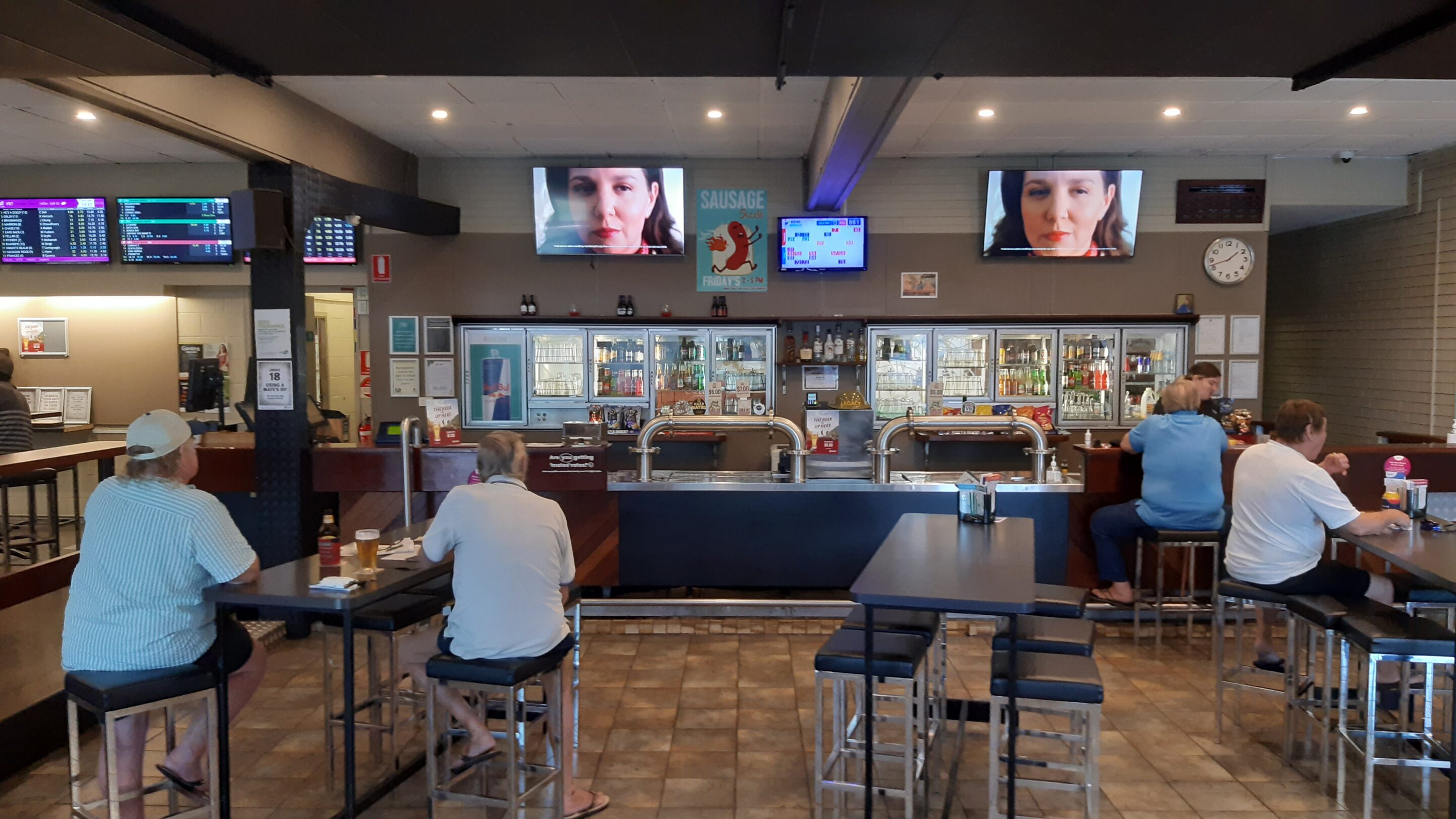 Australian betting venue screens representing influencer gambling advertising risk