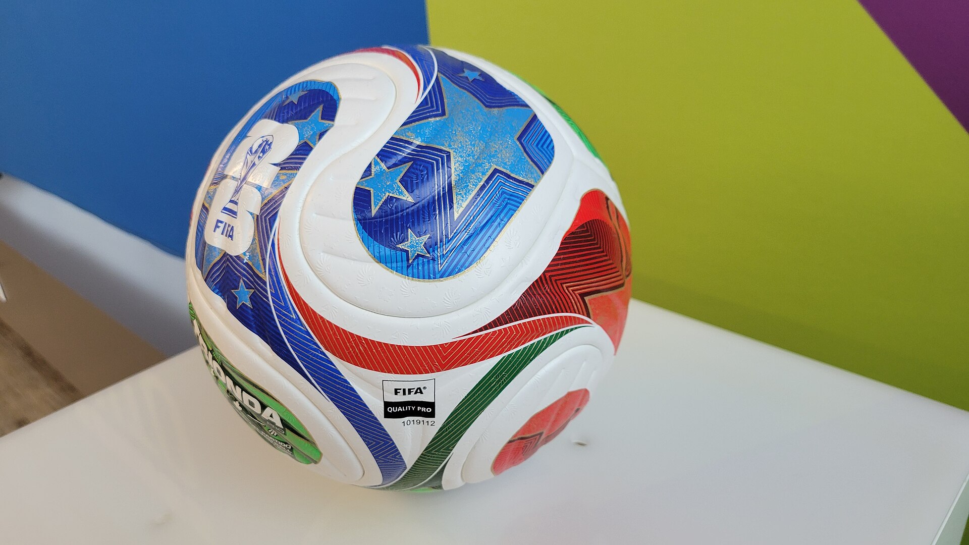 Football on grass representing World Cup betting surges and public money