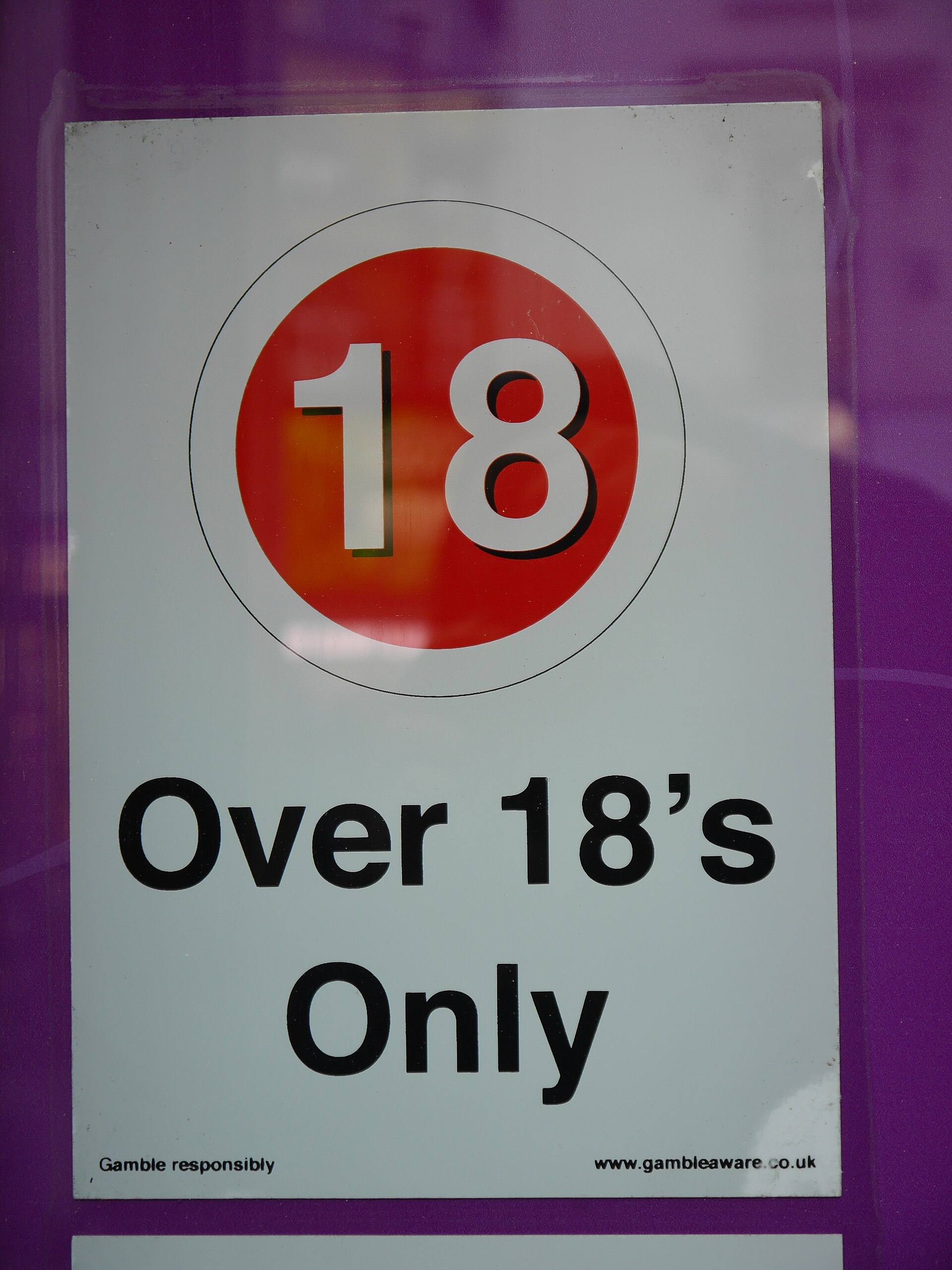 Betting shop over 18 sign representing safer conduct after betting losses