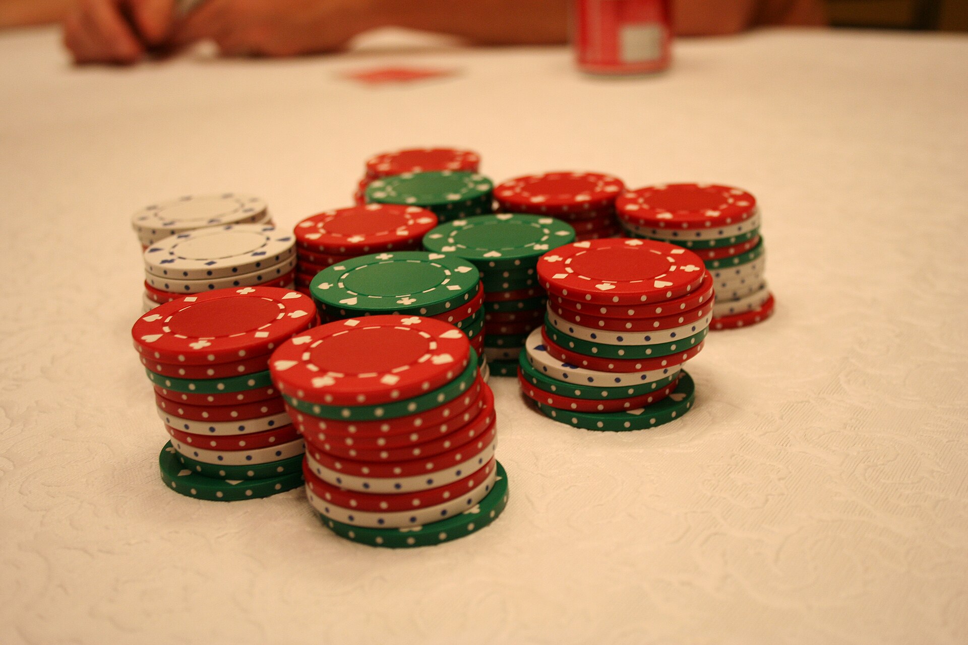 Poker chips in a case representing binary event contracts and fixed payout risk