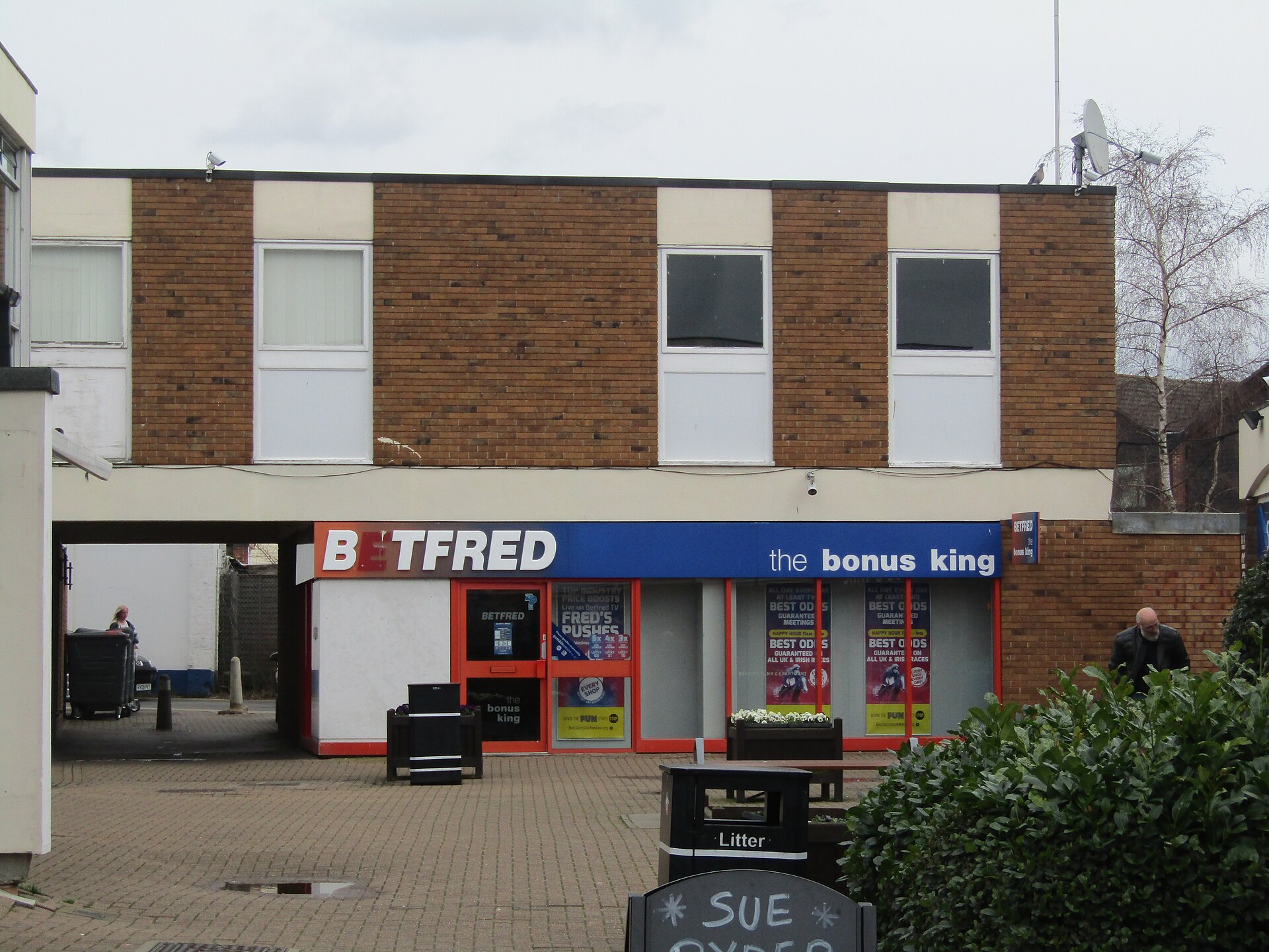 Bookmaker shop representing cash-out button decisions during live betting