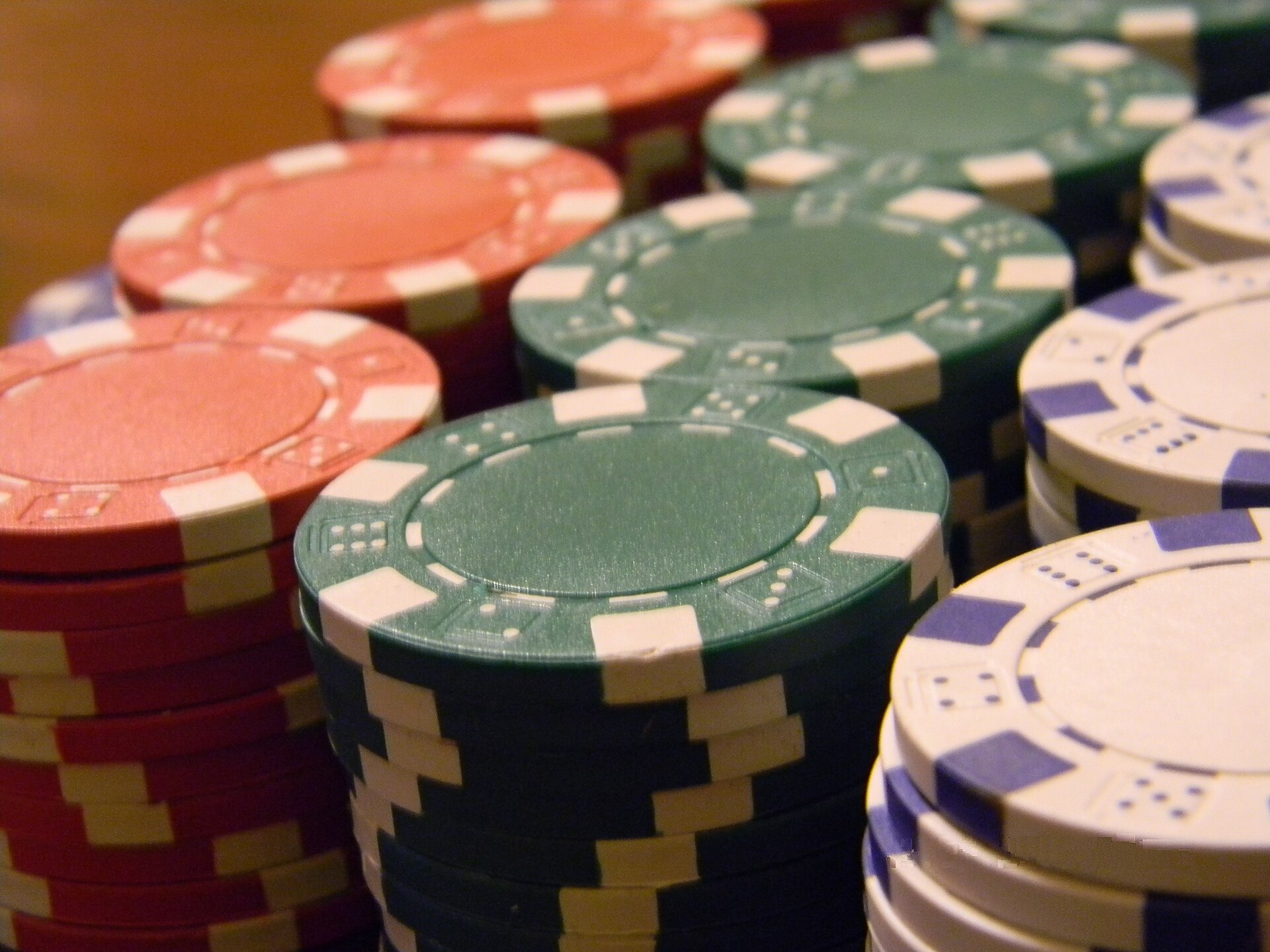 Casino chips representing a casino bonus max-bet rule before wagering