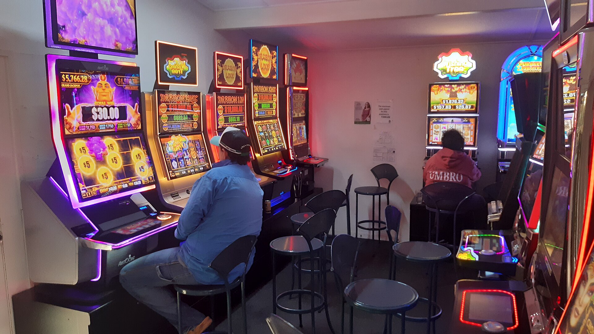 Poker machine room representing NSW poker-machine reform and player loss limits
