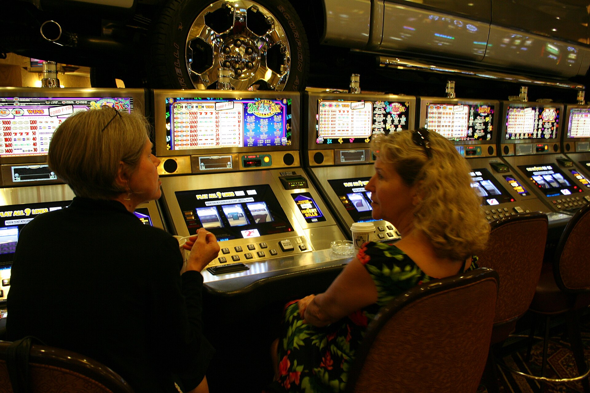 Gaming machines representing pre-commitment systems in gambling