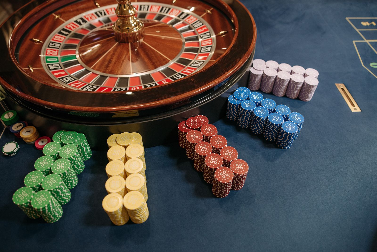 Roulette wheel and casino chips representing adjusted EBITDAR in gambling