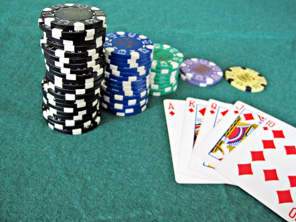 Poker hand and chips representing channelisation in regulated gambling markets