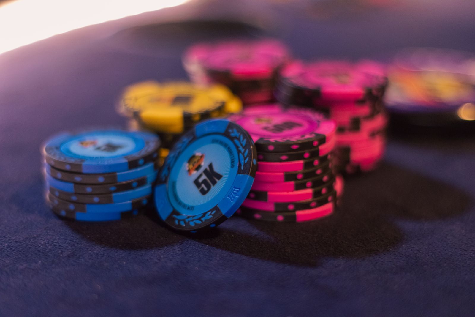 Colourful casino chips representing paid prize draw entries and spending limits