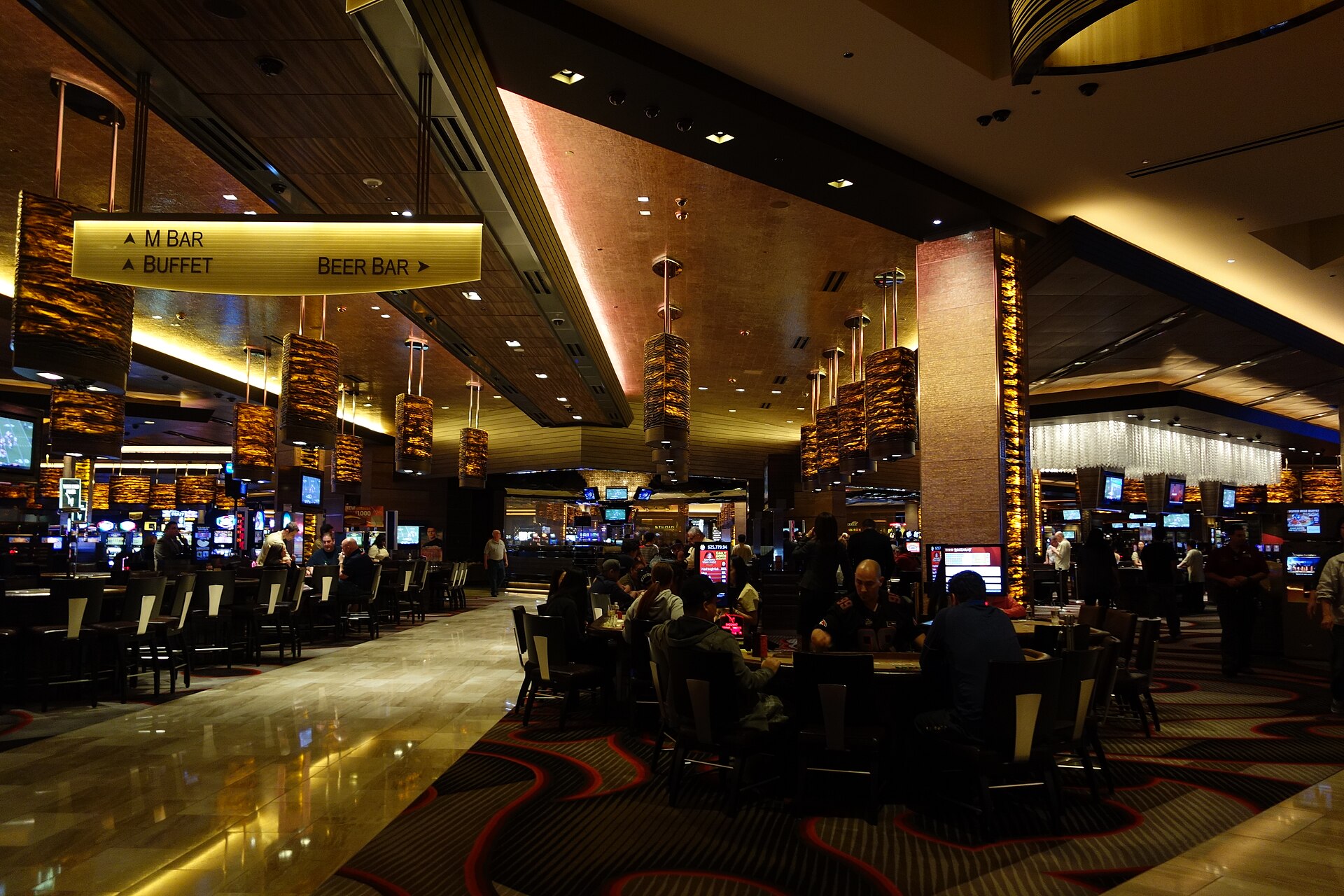 Casino floor with slot machines representing Denmark land-based casino licence bidding