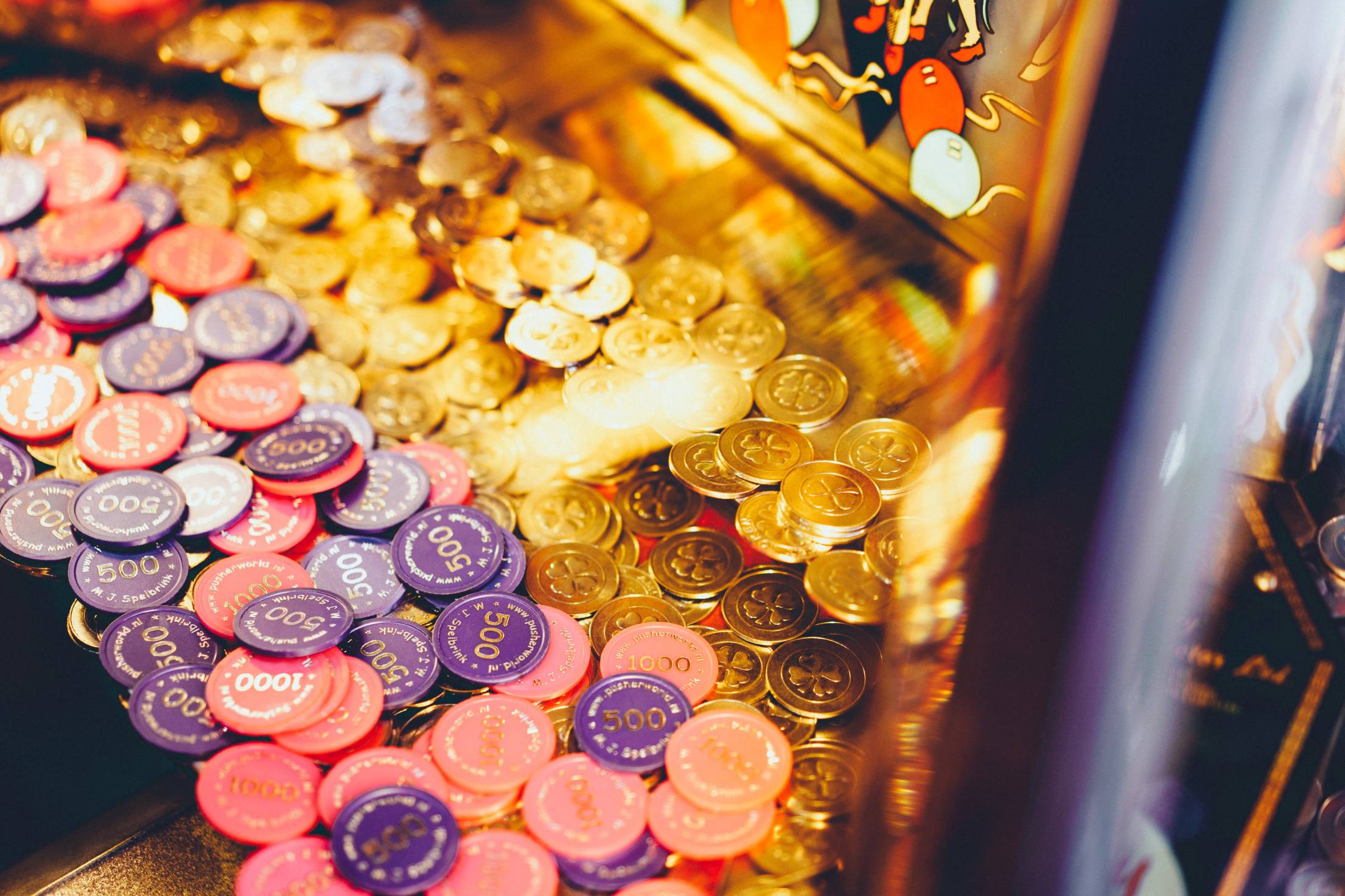 Slot machine with coins and chips representing fake online casino game verification