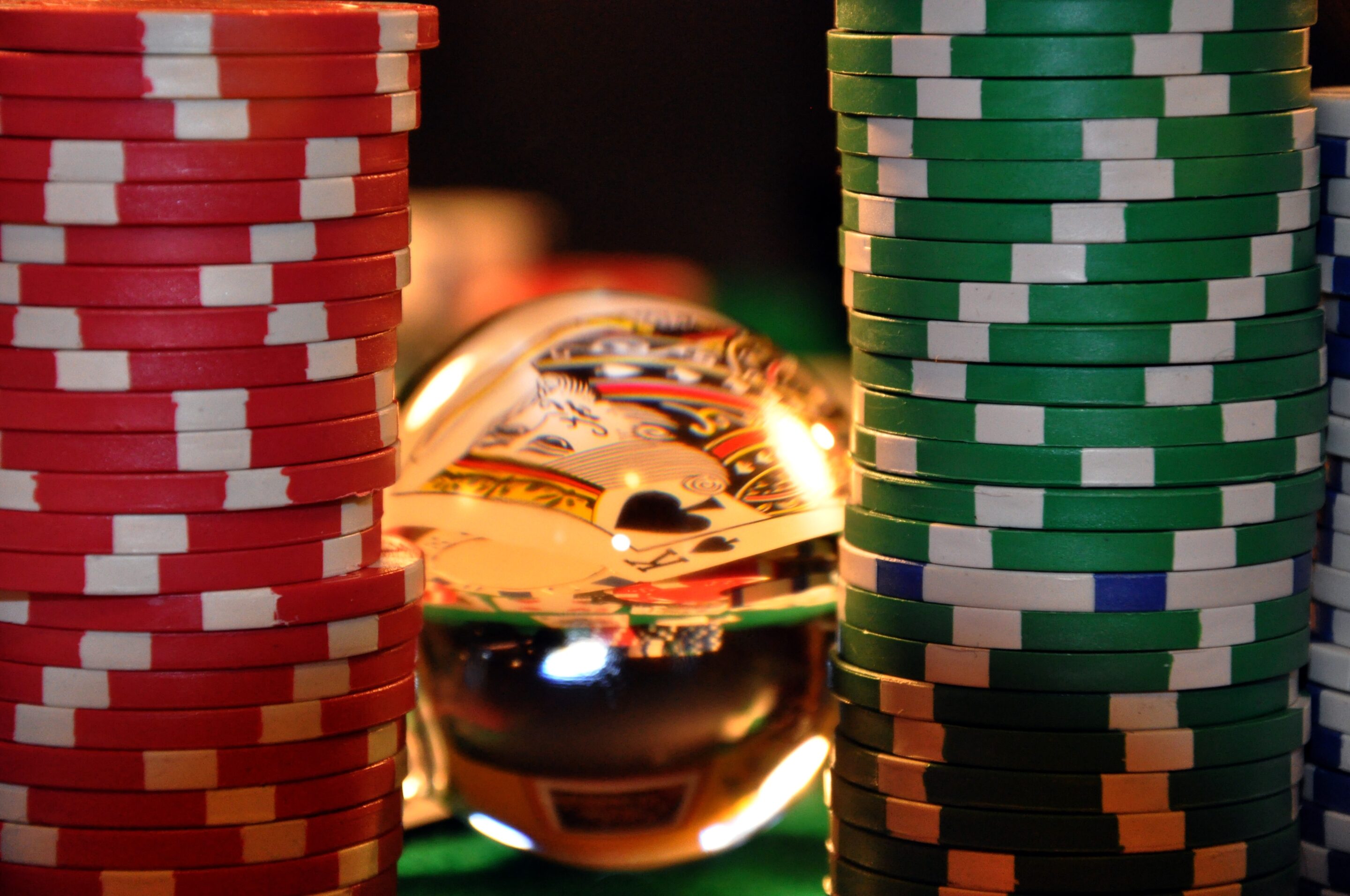 Casino chips and playing card representing gambling inducements and bonus pressure