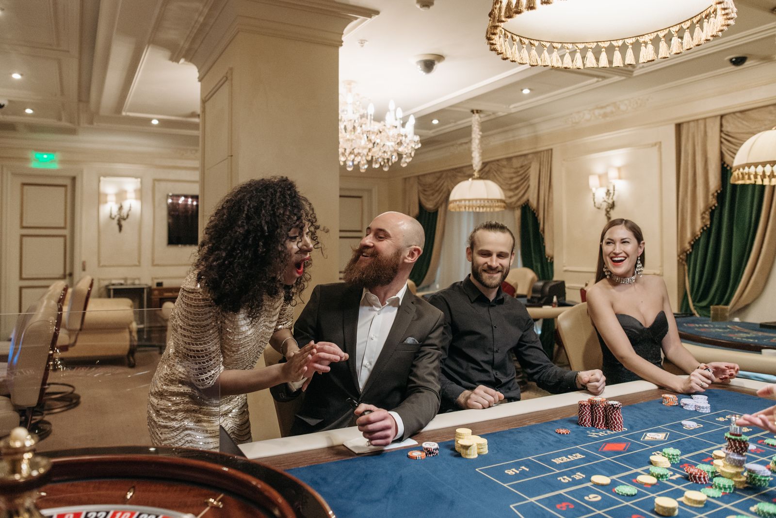 Casino table and players representing gambling levy funding for local harm prevention
