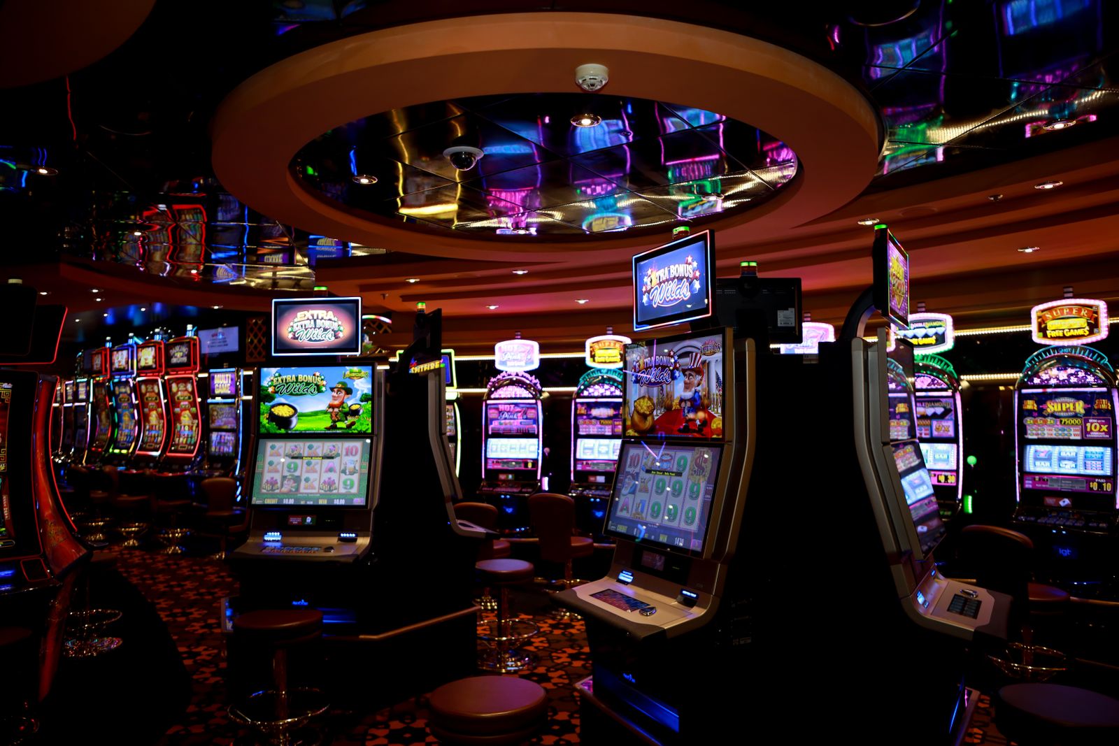 Slot machines inside a casino representing Italy's stalled retail gambling reform