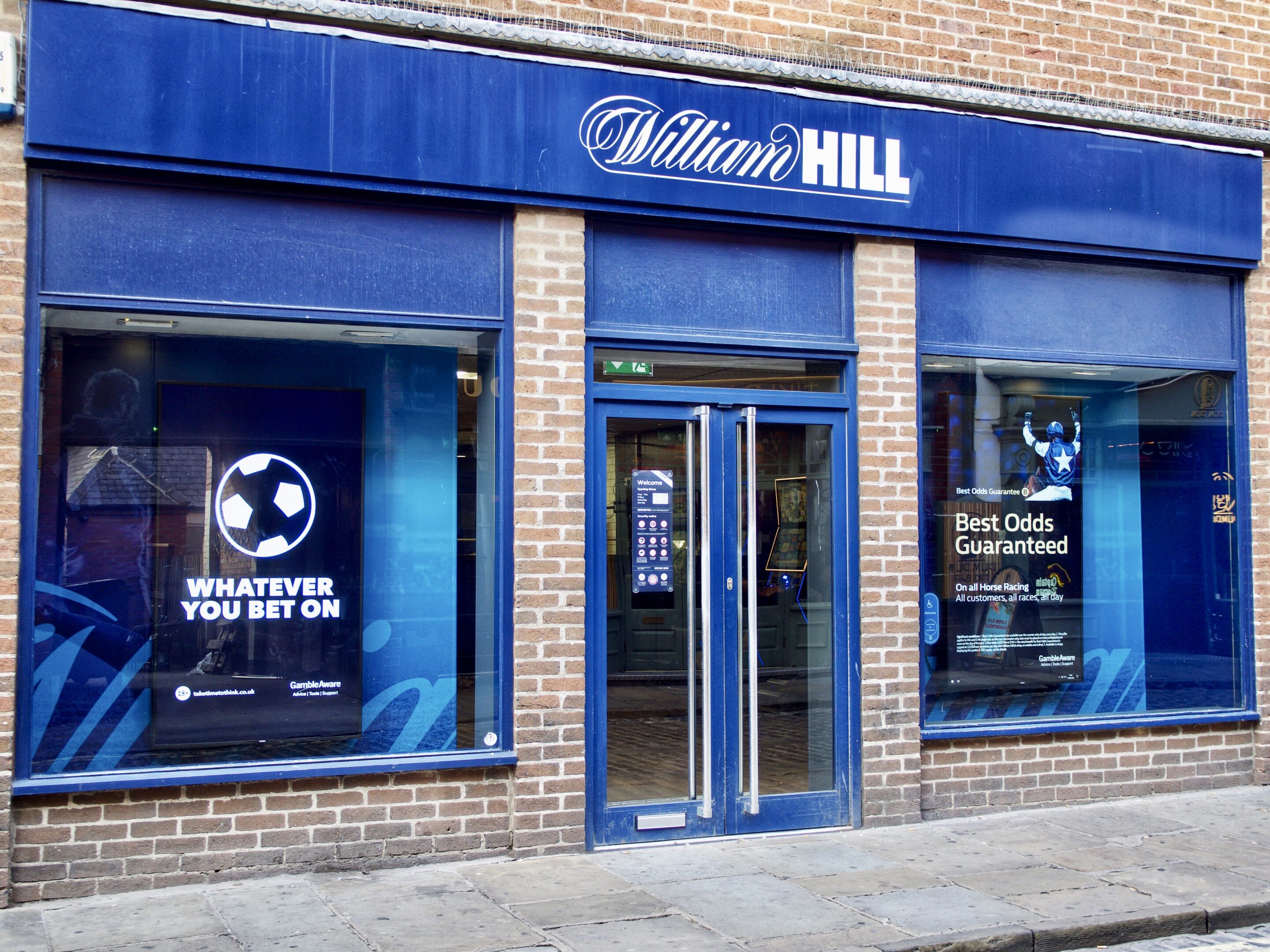Betting shop frontage representing New Zealand online casino advertising guidance