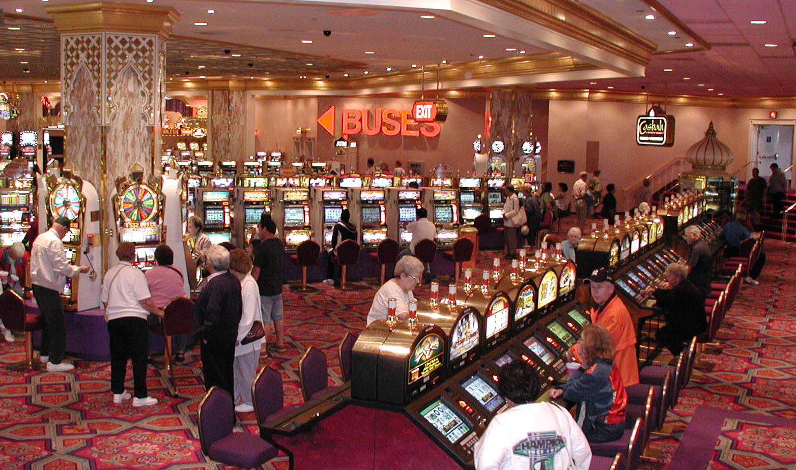Busy casino slot floor representing Paradise Entertainment's Macau loss warning