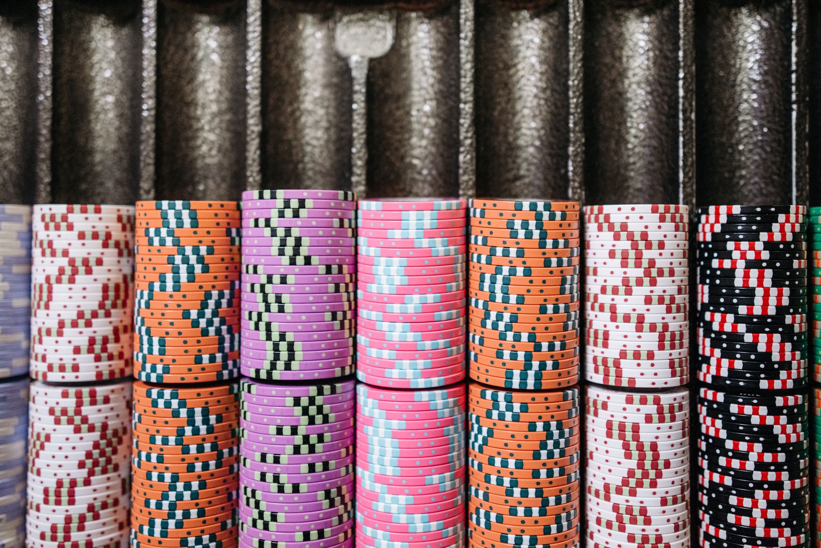 Casino chips on a table representing how players can read casino earnings reports