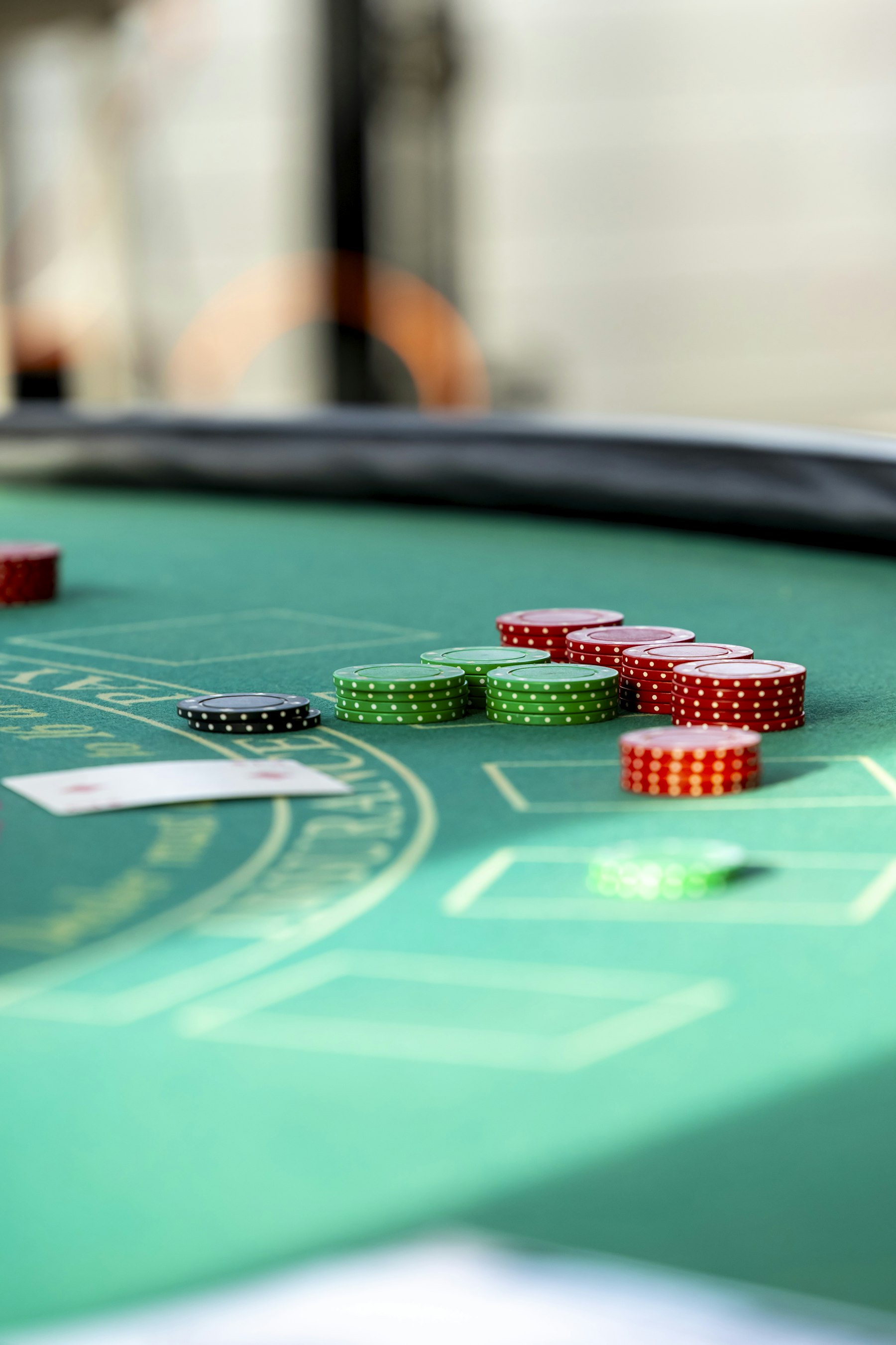 Pile of gambling chips representing remote casino AML risk assessment and payment monitoring