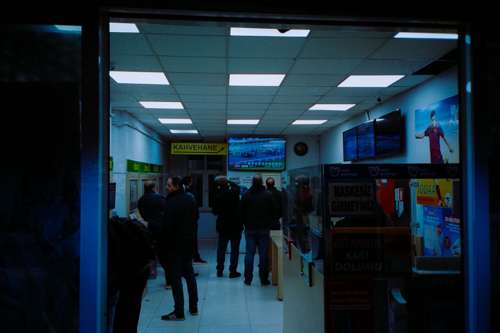 Sports betting shop screens representing deposit limits and safer betting decisions