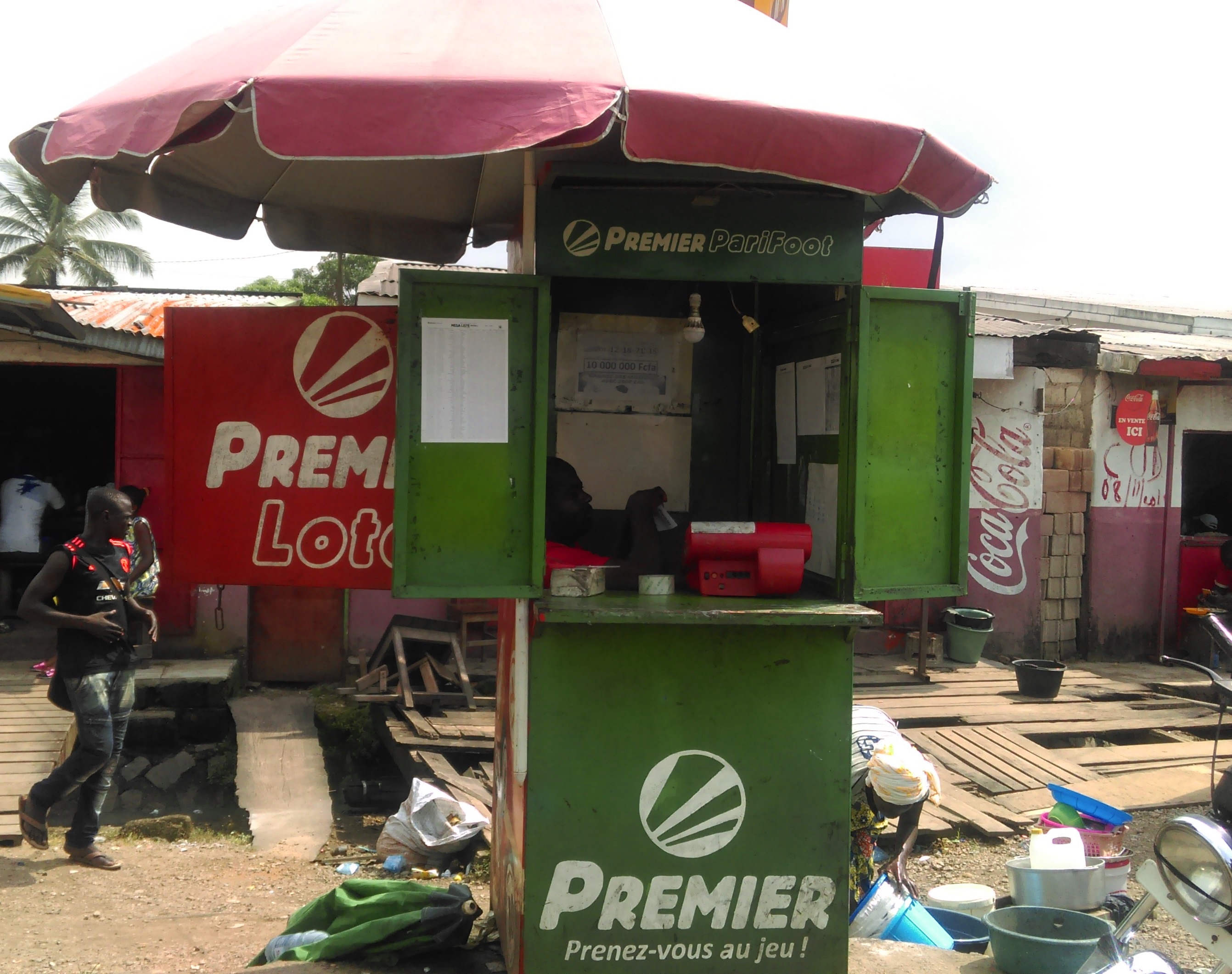 Sports betting kiosk in use representing sportsbook account controls