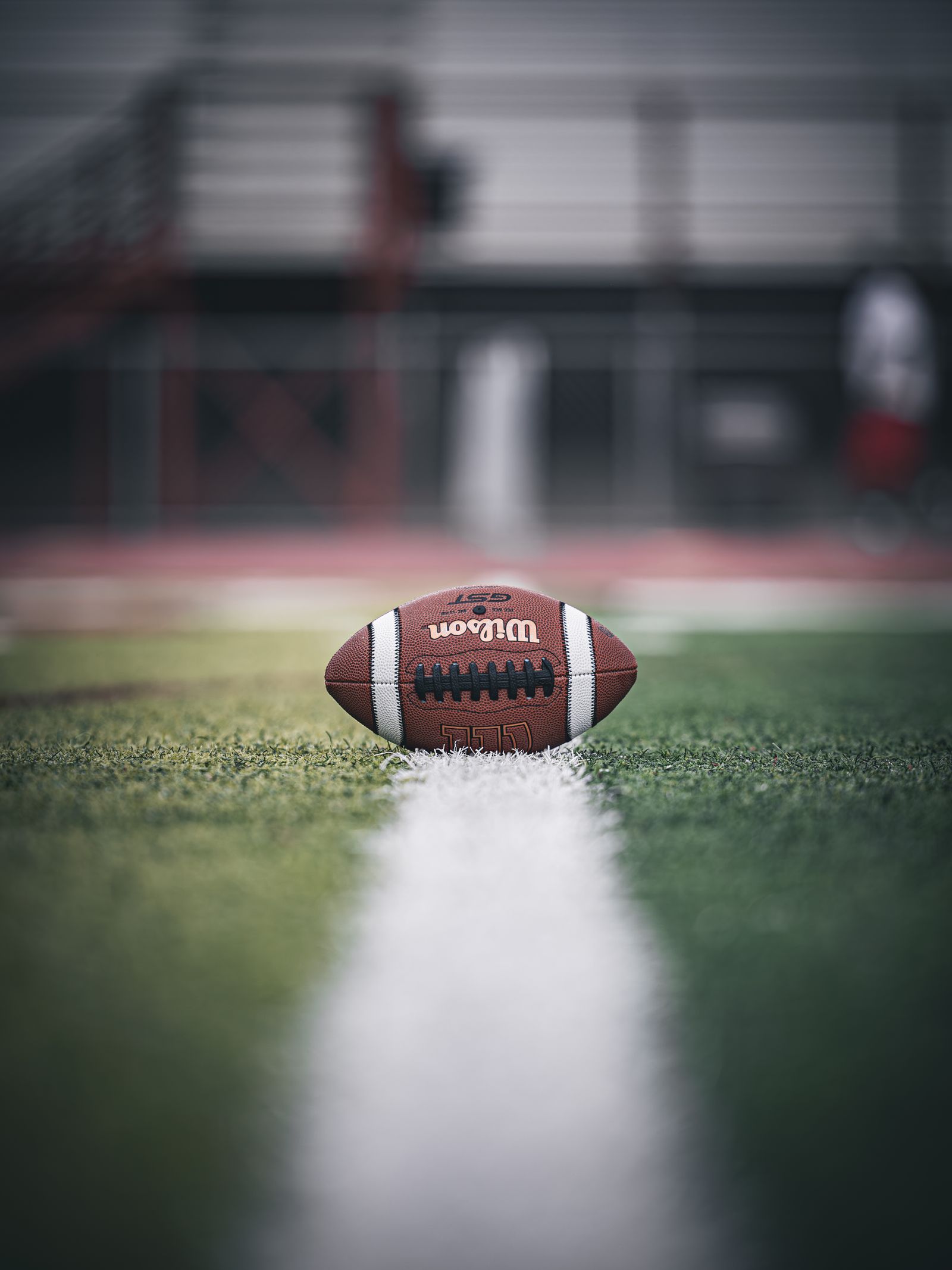 American football on a field representing licensed sportsbook checks before football season