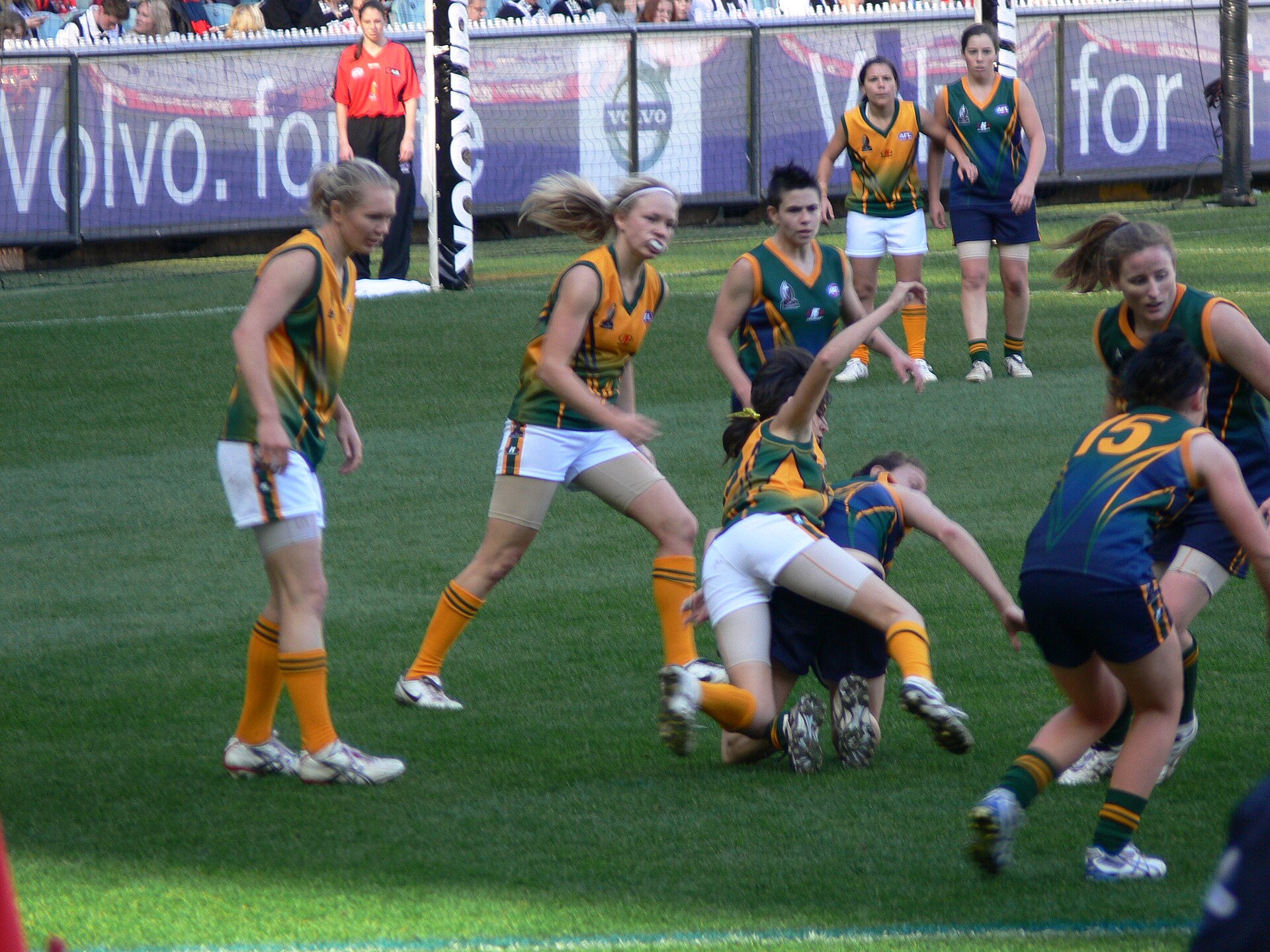 Australian rules football players competing during a match