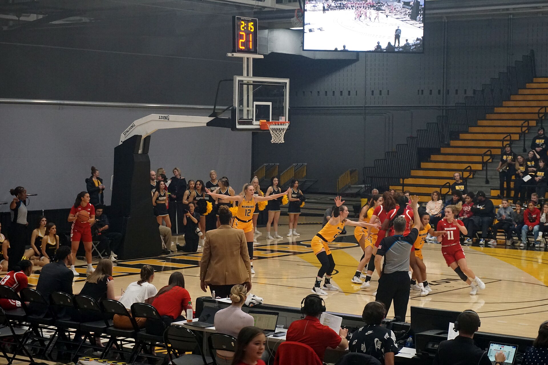 Wisconsin and Milwaukee players in action during a women's basketball game