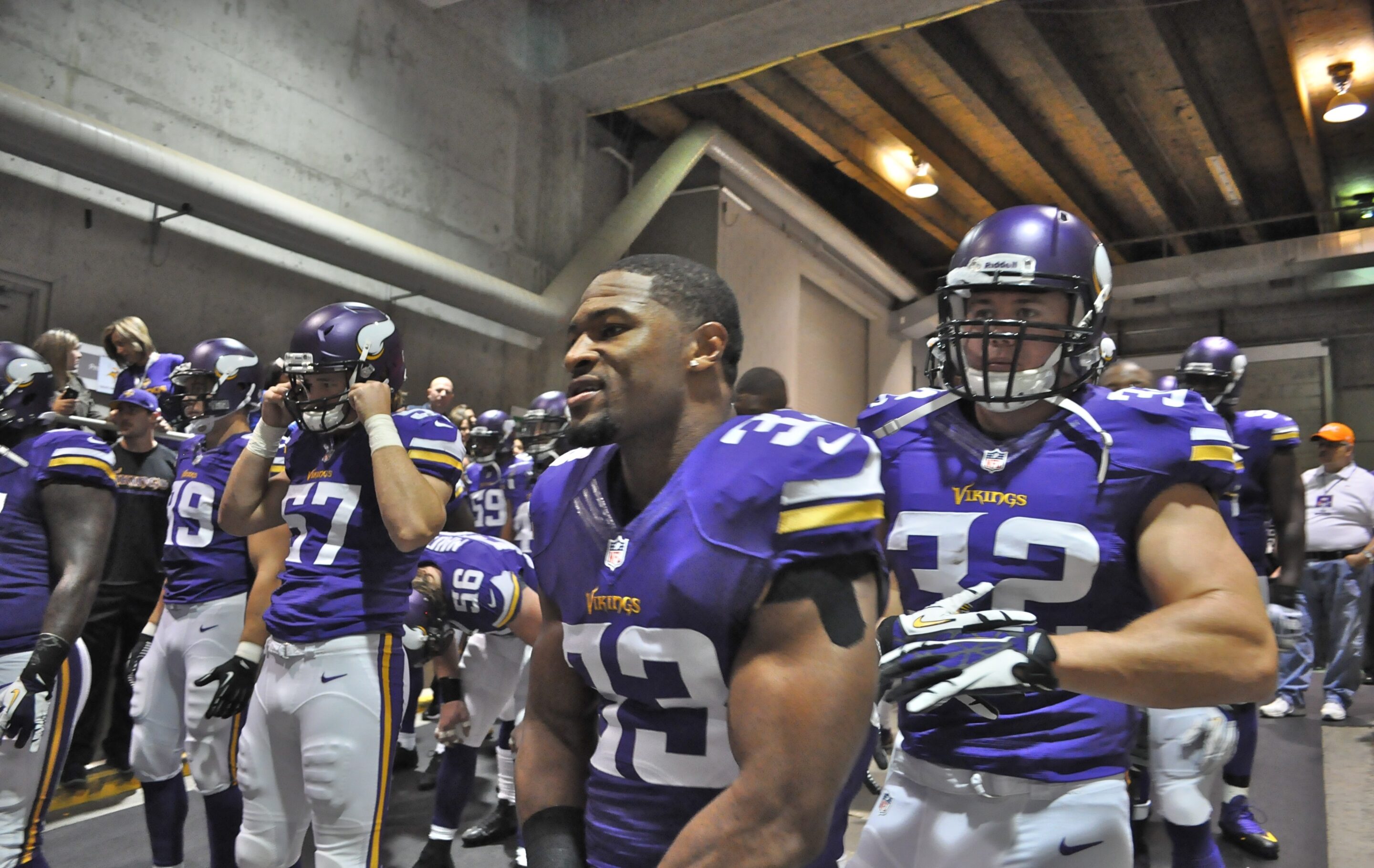 Minnesota Vikings players walking onto the field before an NFL game
