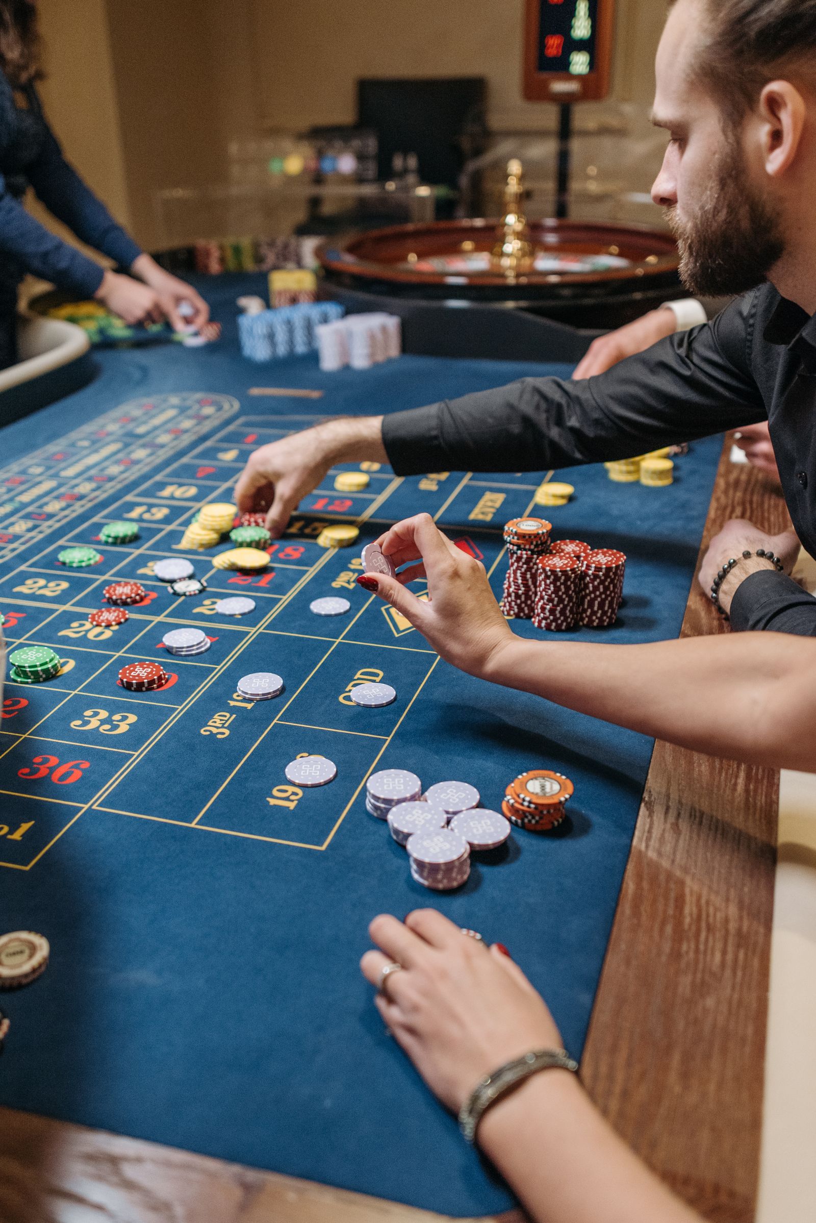 Roulette table with coloured chips representing table tokens and player chip values