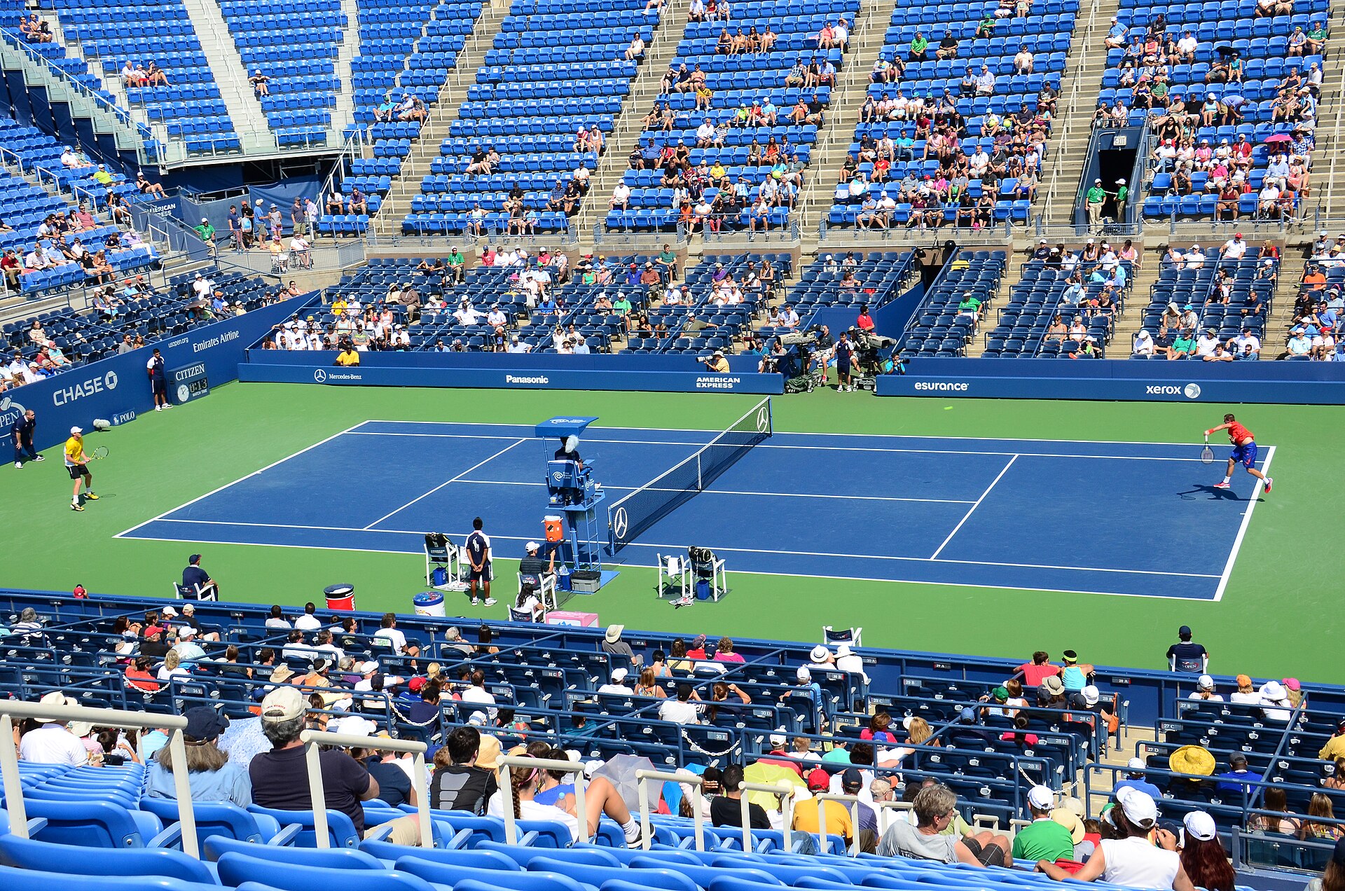 Tennis match in a packed stadium illustrating the latest match-fixing suspension